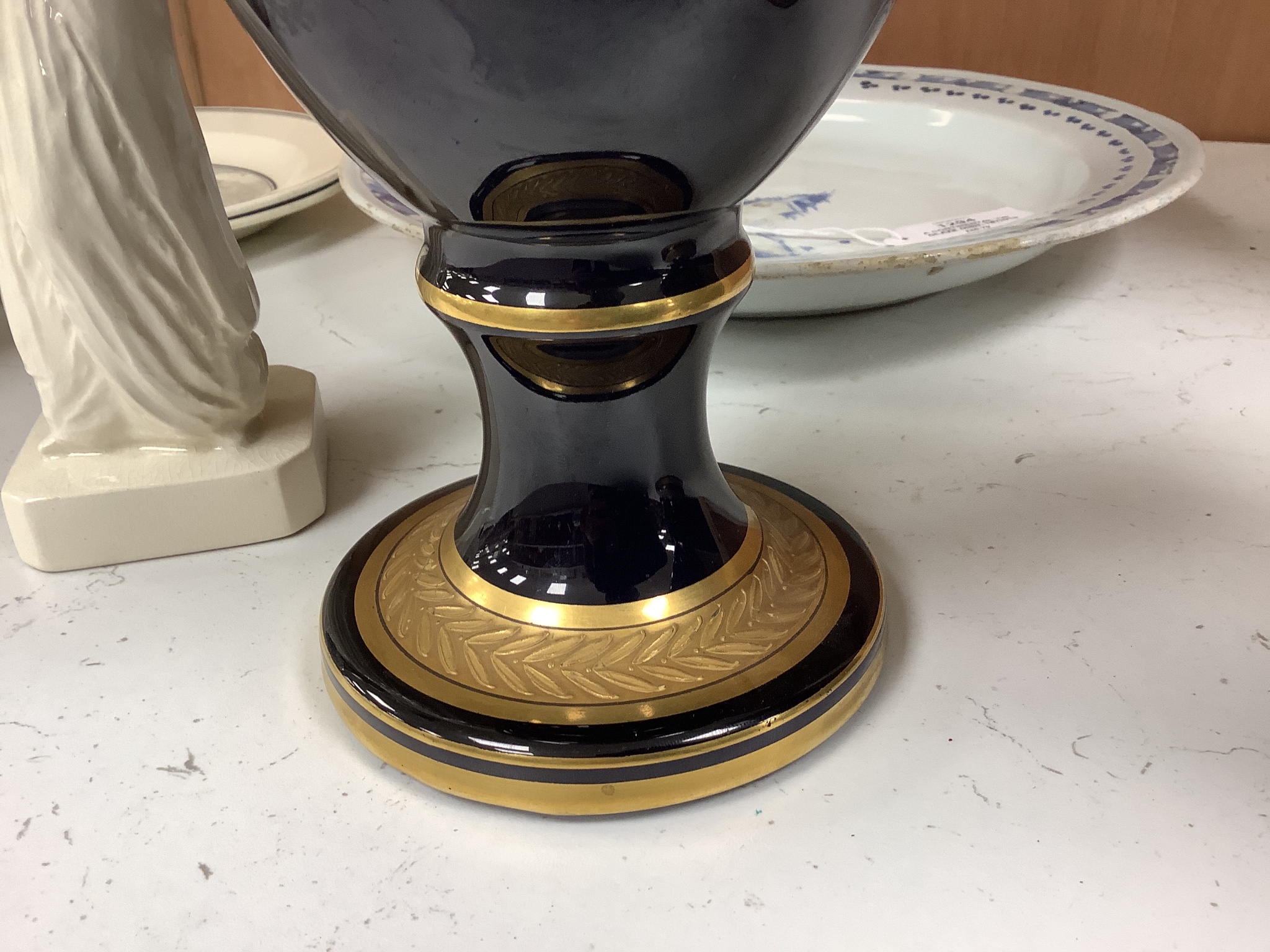 A pair of French gilt blue porcelain two handled vases, height 45cm